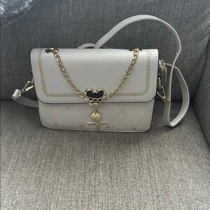 Elegant Cream Shoulder Bag with Gold Accents